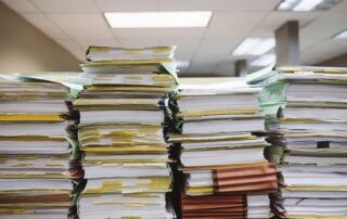 Paperwork to illustrate the move to artificial intelligence in invoice processing